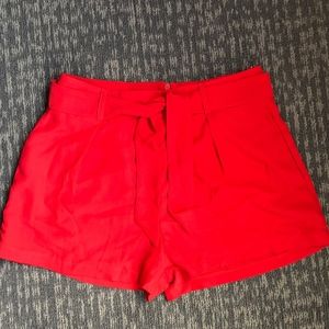 GUESS red belted shorts